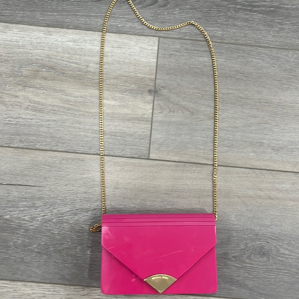 Pink plastic Michael kors clutch with shoulder strap